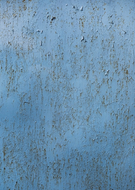 Textura de pared azul pintada agrietada