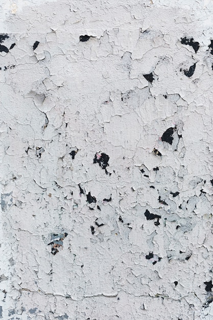 Foto gratuita textura de pared blanca pintada agrietada