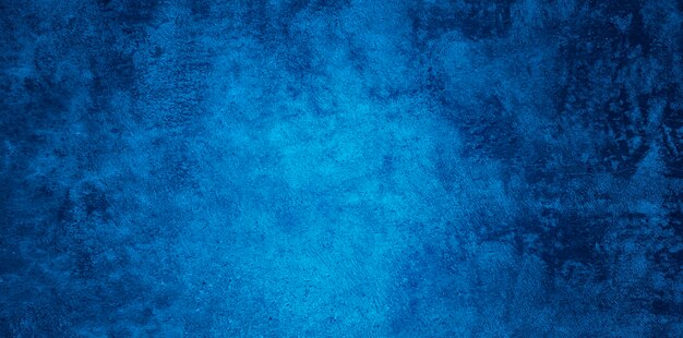 Textura de pared de estuco azul marino de relieve decorativo abstracto Grunge. Fondo de color rugoso de gran angular