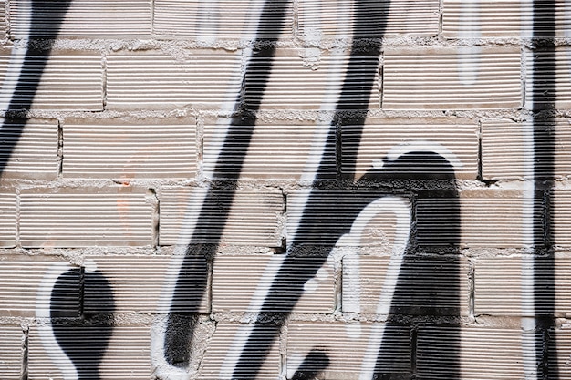 Textura de pared de ladrillo con graffitti