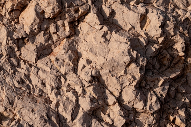 Textura de pared de piedra apilada agrietada