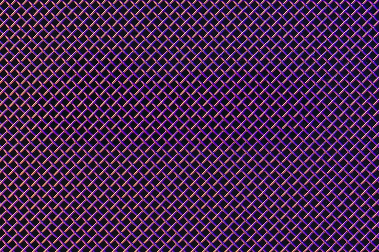Foto gratuito textura de primer plano de una parrilla de metal de un altavoz de música en iluminación de colores