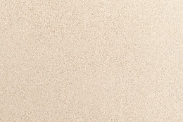 Textura de la superficie de arena fondo beige zen y concepto de paz