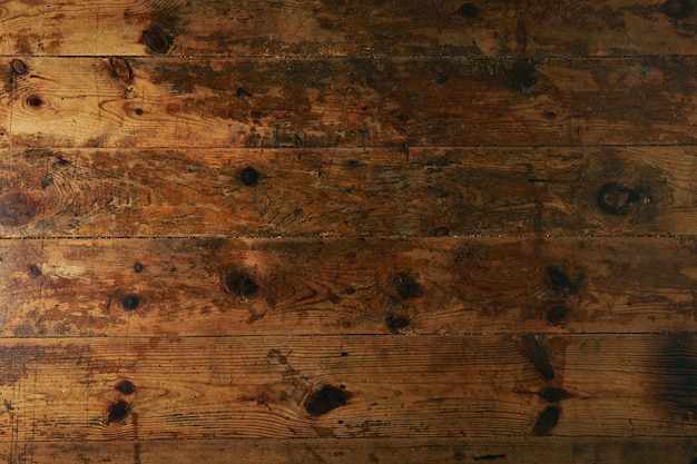 Textura de una vieja mesa o piso marrón oscuro desgastado, primer plano