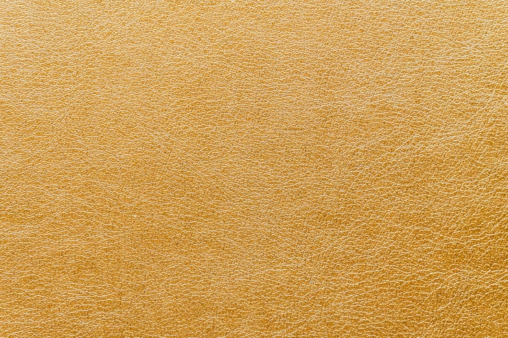 Foto gratuito texturas abstractas en piel dorada.