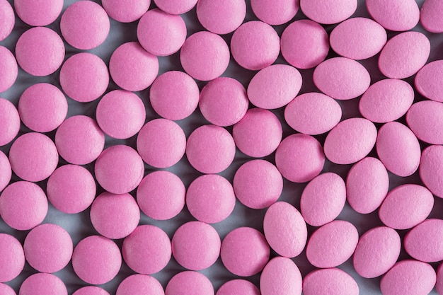 El tiro completo del marco de puede píldoras rosadas