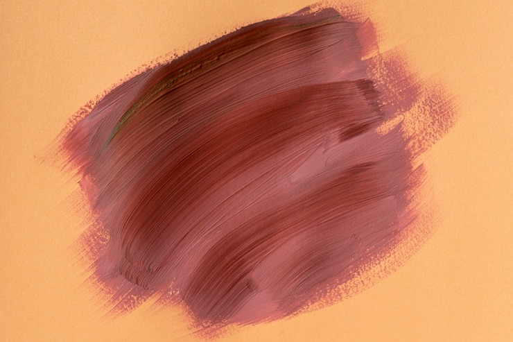 Foto gratuito trazo de pincel abstracto sobre fondo naranja