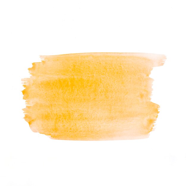 Trazo de pincel dibujado a mano acuarela amarilla sobre papel blanco