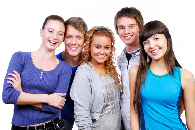 Unidad de amigos felices compañeros de clase. Foto de estudio sobre un fondo blanco.