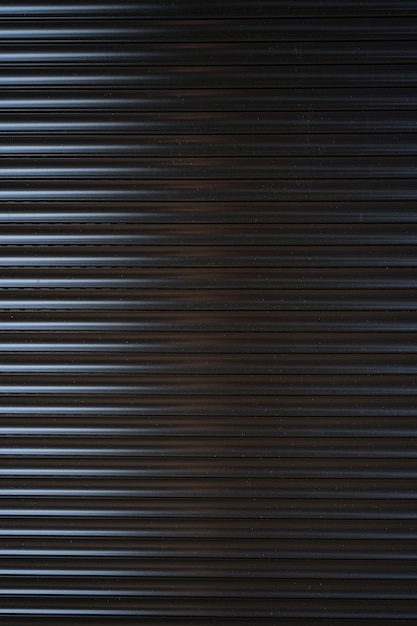 Foto gratuita valla de estaño de hierro negro forrado de fondo. textura de metal
