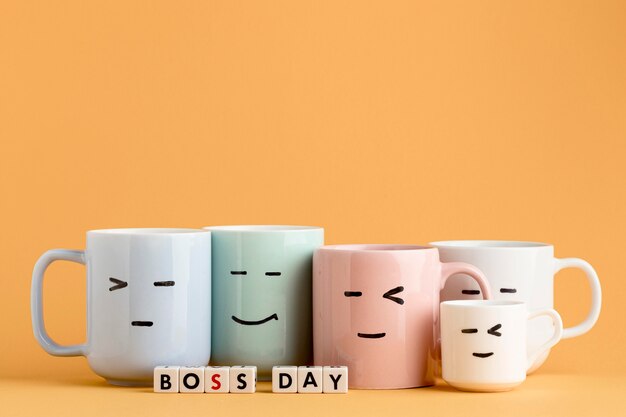 Vista frontal del concepto del día del jefe con tazas