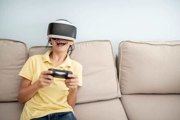 Foto gratuito vista frontal niño riendo jugando con gafas vr