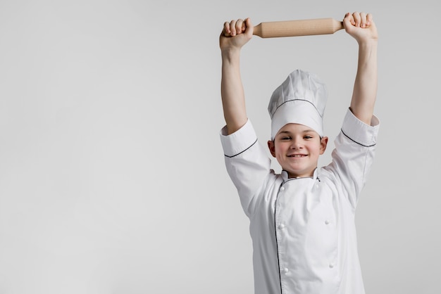 Bebé en el traje de cocinero Foto de stock 501192943