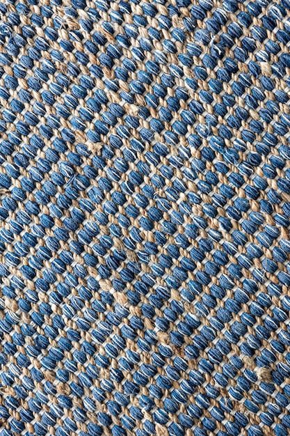 Vista plana de la textura de fondo de la alfombra de yute trenzada de color azul