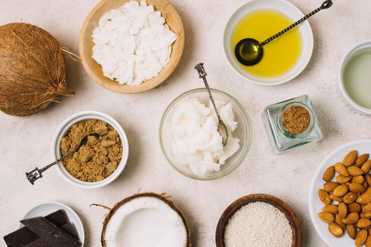 Foto gratuito vista superior deliciosos productos de coco nutritivos con bocadillos