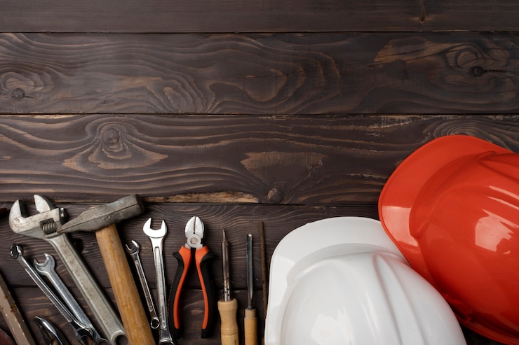 Foto gratuito vista superior del día internacional del trabajador con herramientas de ingeniería.