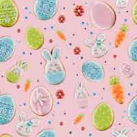 Foto gratuita vista superior de galletas glaseadas de jengibre y puntos coloridos aislados en rosa