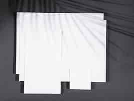 Foto gratuita vista superior de papeles en blanco con sombras
