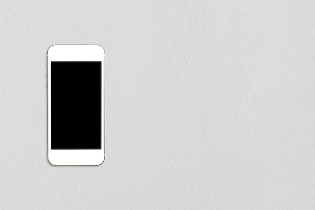 Vista superior smartphone simulacro plantilla con pantalla en negro sobre la mesa de cemento con copyspace.