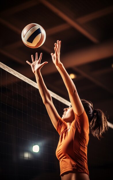 Voleibol con jugadora y pelota.