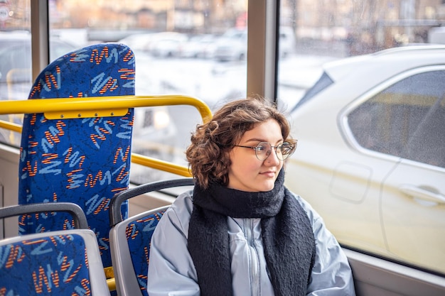 a female student rides public transport public transportation and people concept