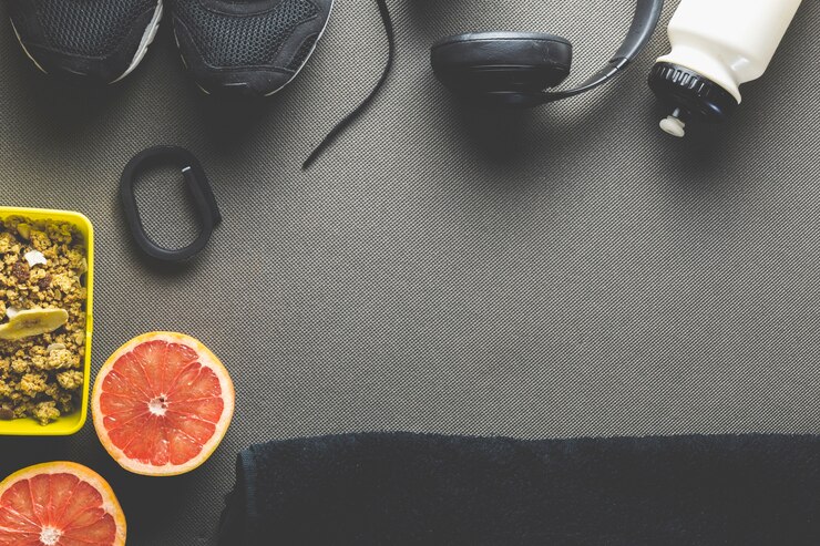 Foto gratuito asciugamano vicino alle forniture sportive