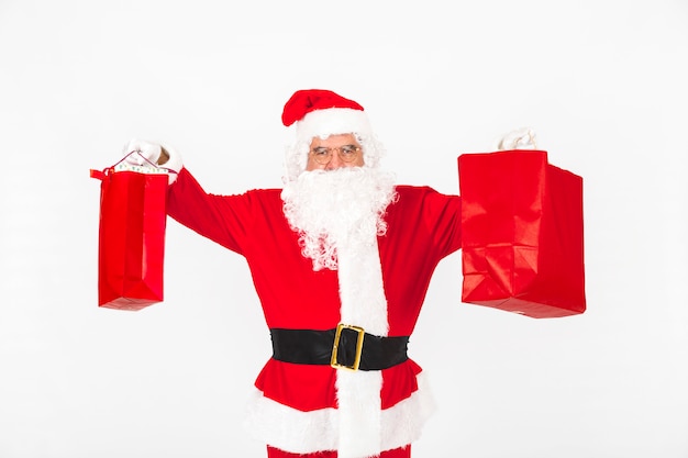 Babbo Natale che alza le borse di Natale