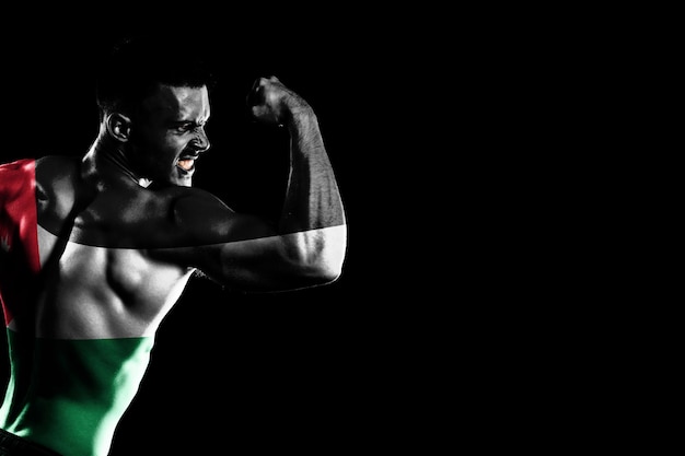Bandiera della Giordania sul bel giovane uomo muscoloso sfondo nero