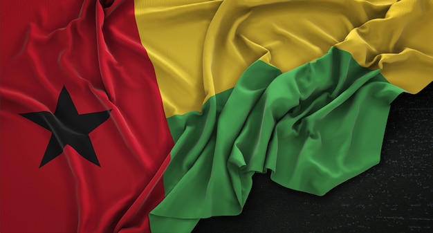 Bandiera della Guinea-Bissau rugosa su sfondo scuro 3D rendering