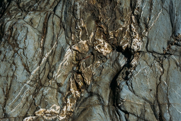 Bella vecchia struttura di roccia per lo sfondo