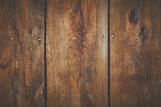 Bordo di legno marrone delle plance per fondo o carta da parati