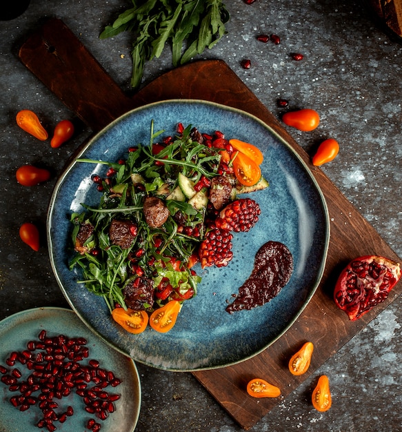 Carne fritta con erbe e melograno