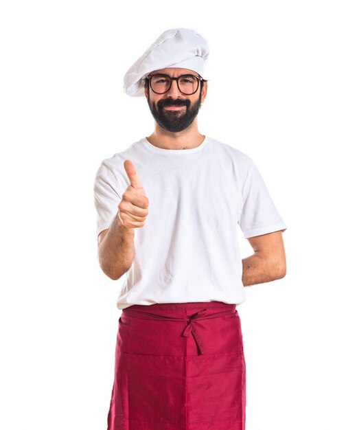 Chef con pollice in su su sfondo bianco