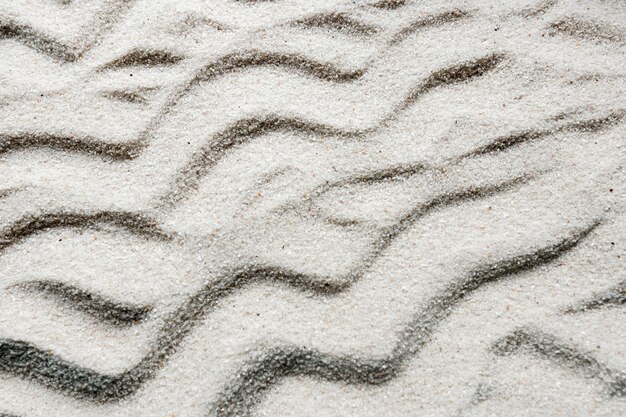 Close-up di sabbia con linee ondulate