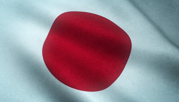 Colpo del primo piano della sventola bandiera del Giappone con trame interessanti