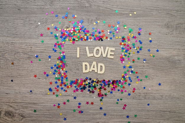 Composizione del giorno del padre con cornice in confetti