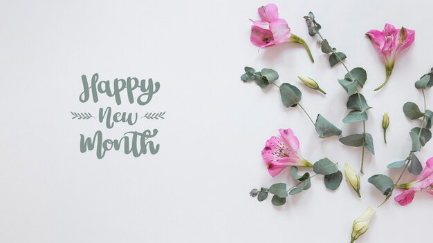 Composizione di fiori con scritta Happy New Month