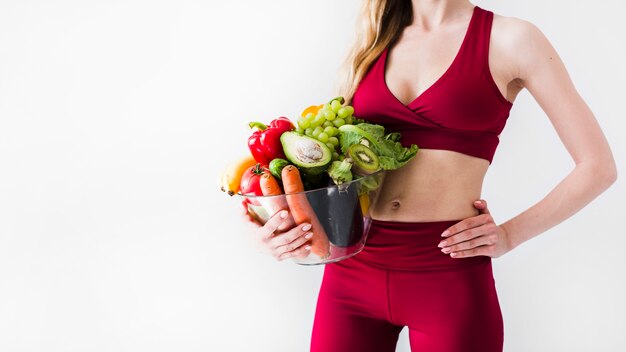 Concetto di dieta con sport donna e cibo sano