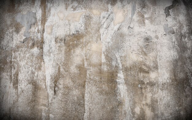 Concetto materiale di struttura del fondo graffiato muro di cemento