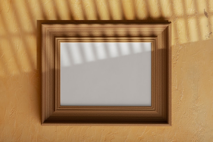 Foto gratuito cornice vuota in legno sulla parete