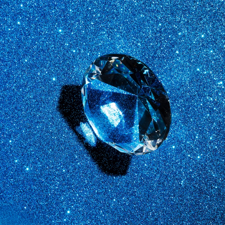 Foto gratuito diamante circolare sul fondo di struttura del blu di scintillio