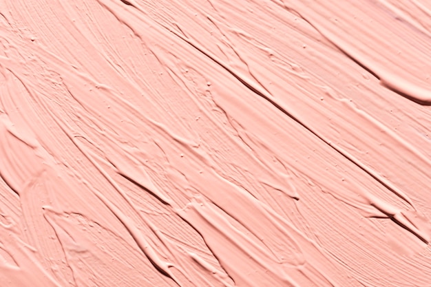 Disposizione piatta di pennellate di vernice rosa sulla superficie