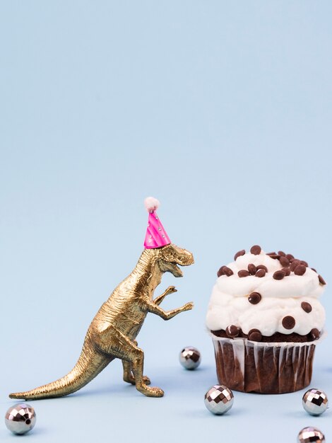 Divertente giocattolo t-rex con cappello compleanno