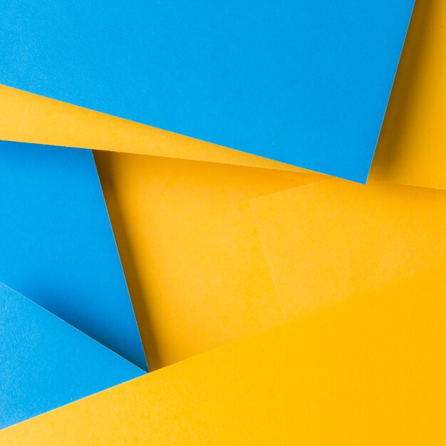 Fondo astratto del contesto blu e giallo della carta di struttura