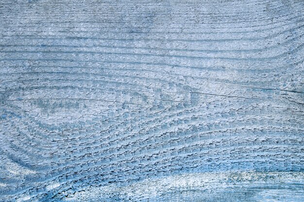 Fondo di legno blu con linee orizzontali e nodo a forma di occhio