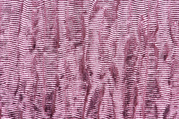 Fondo strutturato del tessuto lucido rosa