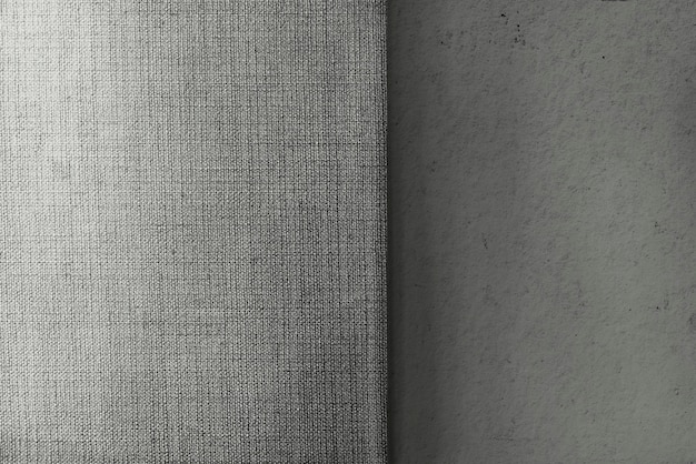 Fondo strutturato grigio del tessuto della tela e del cemento
