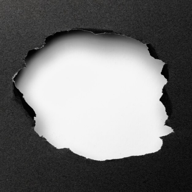Forma bianca astratta del ritaglio su fondo nero