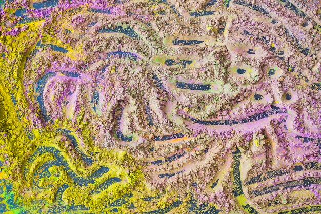 Full frame di impronte digitali su polvere color holi