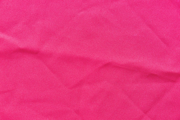 Full frame di sfondo rosa tessuto
